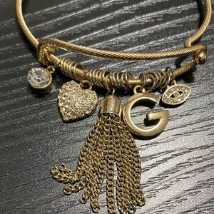 Guess Gold Charm Bracelet with Tassel and Heart Accents